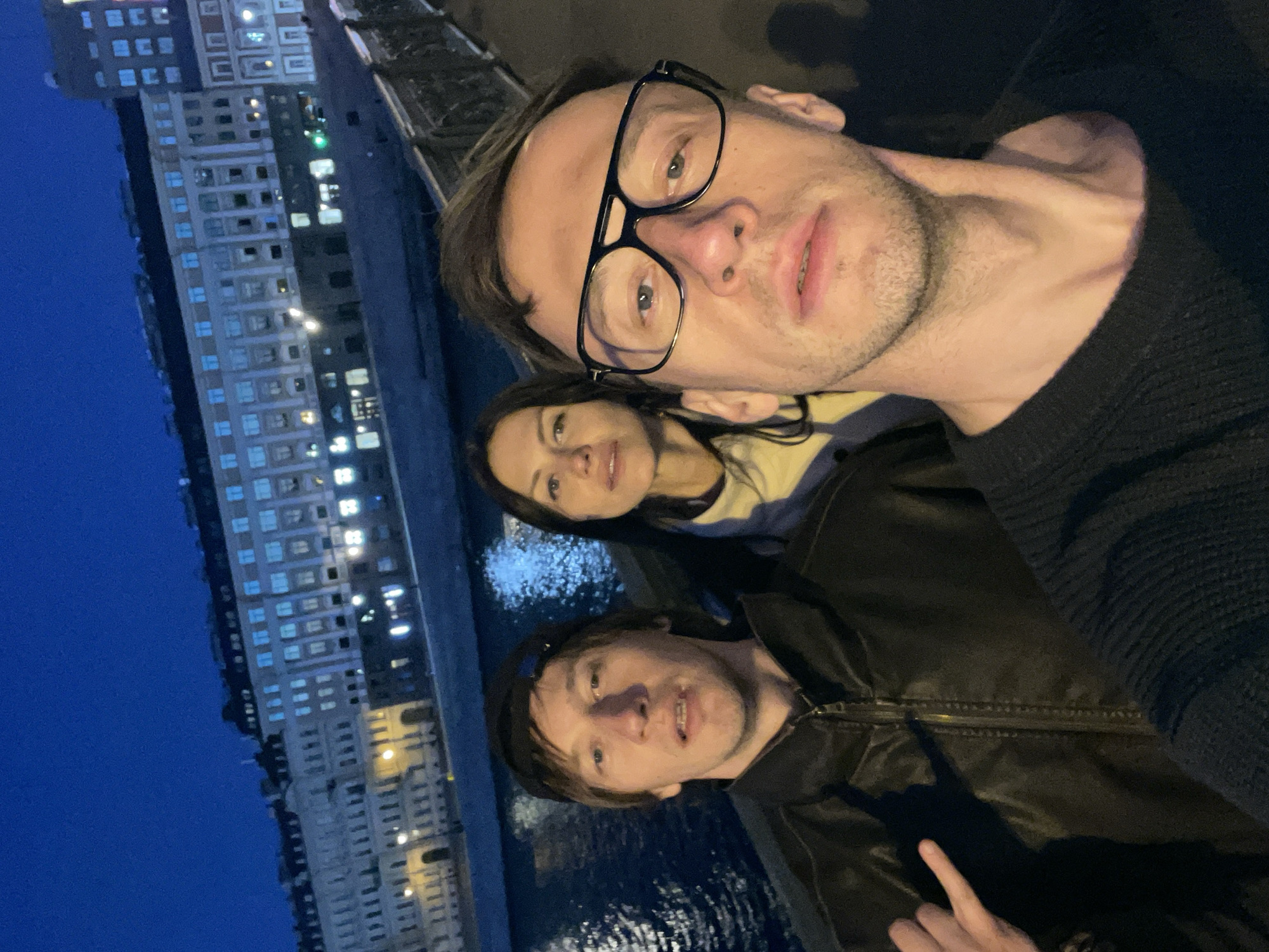 Nighttime social gatherings captured across city waterfront locations