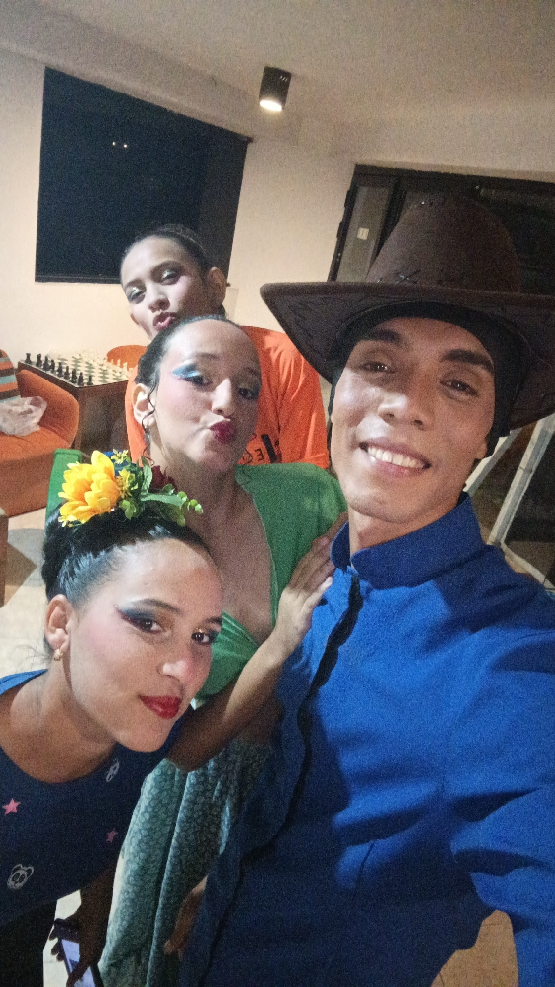 Young adults gather indoors at Playa El Agua, Venezuela