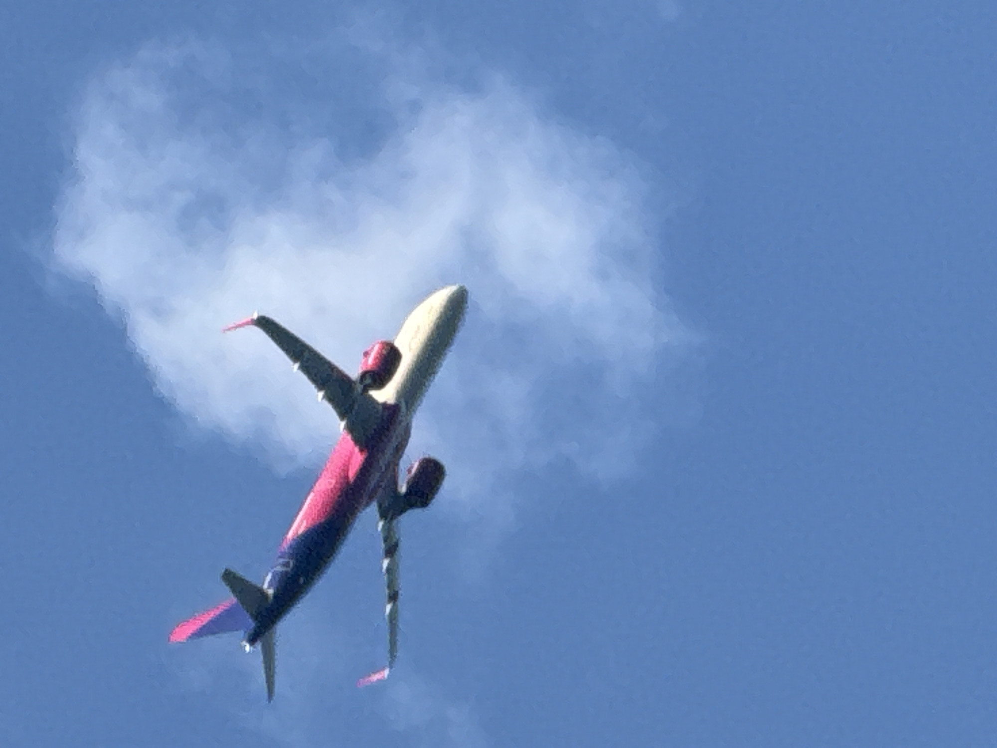 Crowded summer beach day in Varna with a passing aircraft
