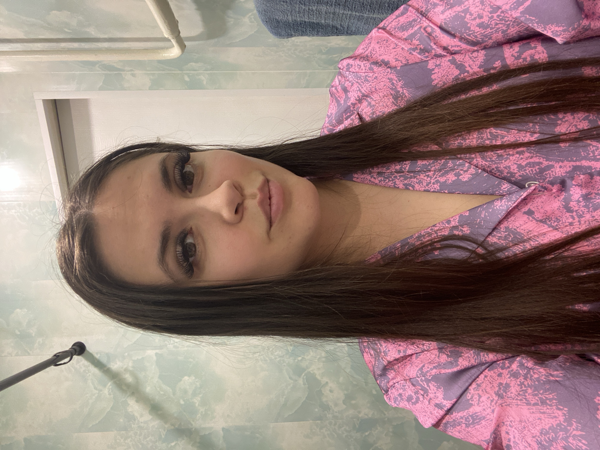 Woman takes late-night selfies in bedroom in Chaikovsky