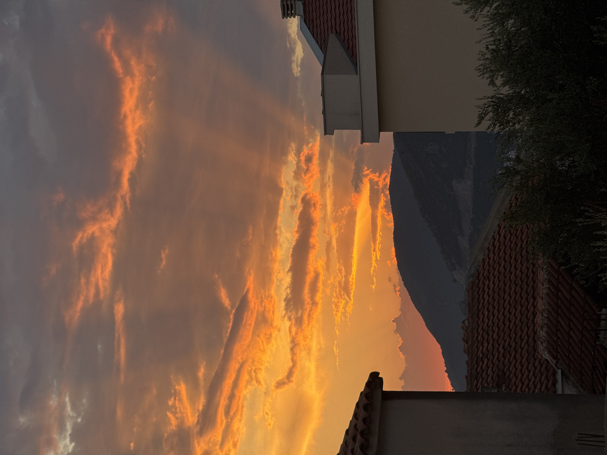 Fiery sunset over Trap, Montenegro — plus a calico cat