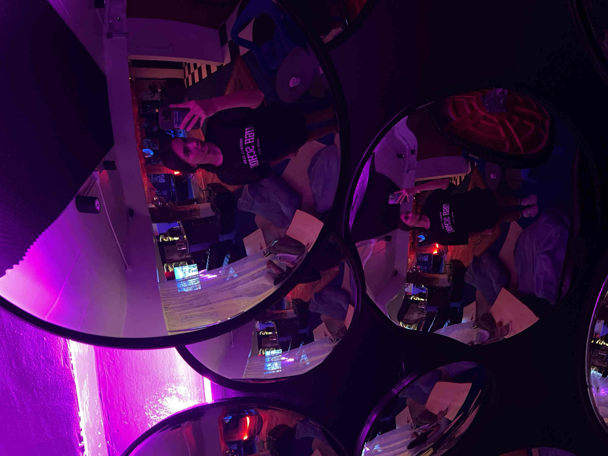 Visitor documents mirror art installation at Phuket lounge venue