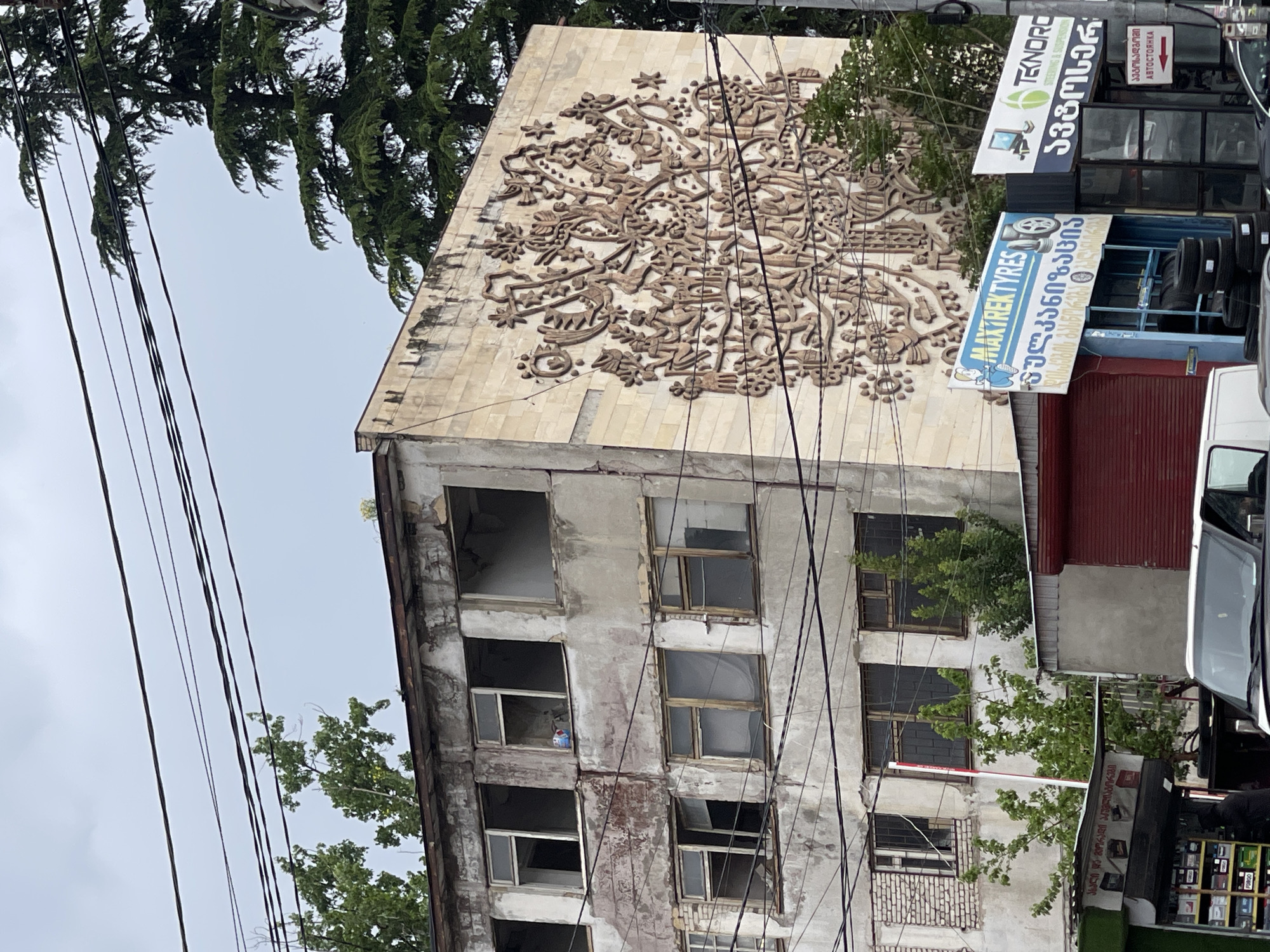 Witness documents damaged cars, buildings, auto shops in Tbilisi