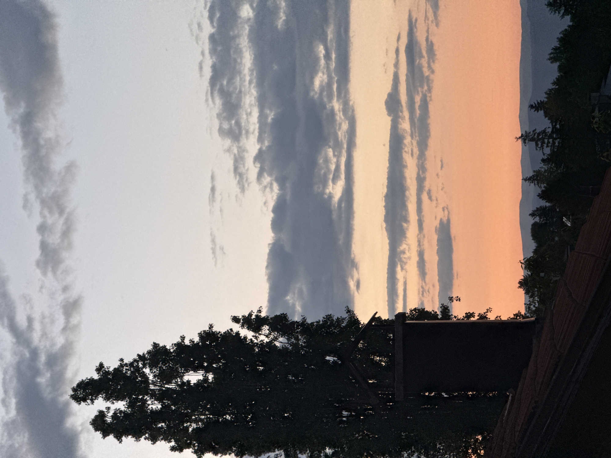 Sunset captured over Sofia residential rooftops June evening