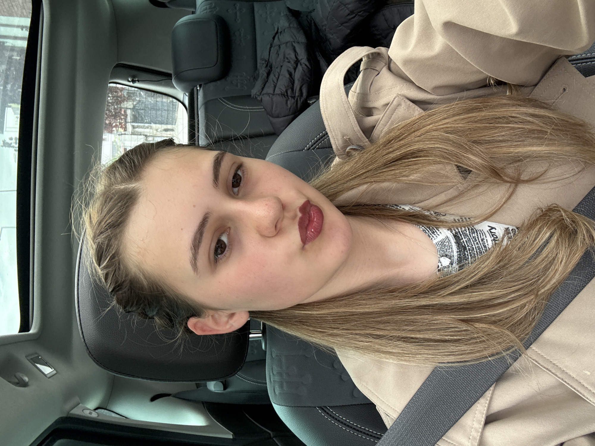 Woman takes car selfies in Panagyurishte, Bulgaria