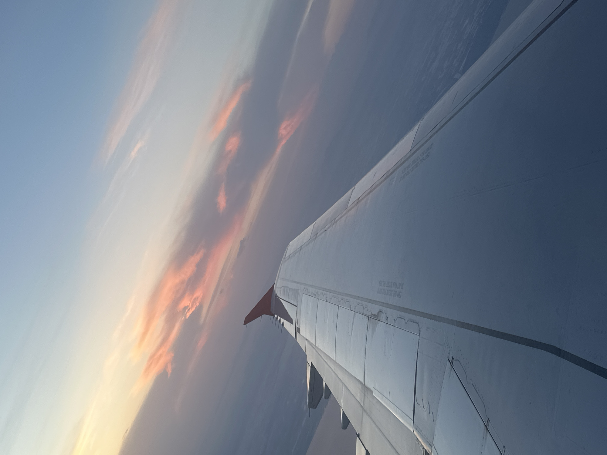 Aircraft wing photographed from passenger window over Turkey