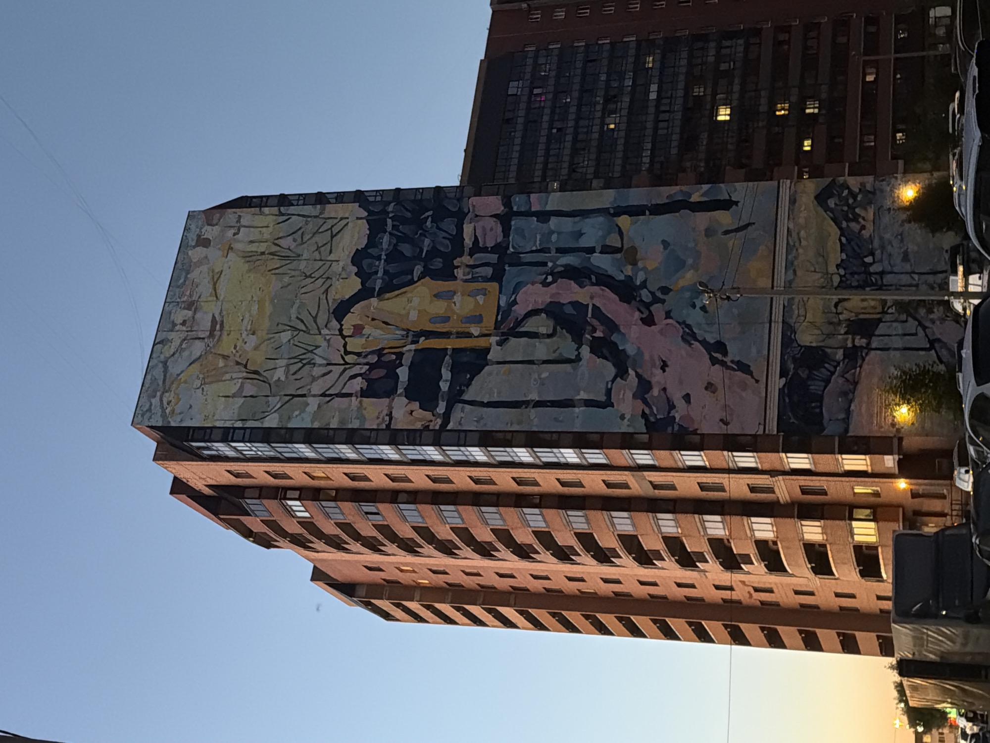 Mural building at dusk, a wrap being made, random shelf finds