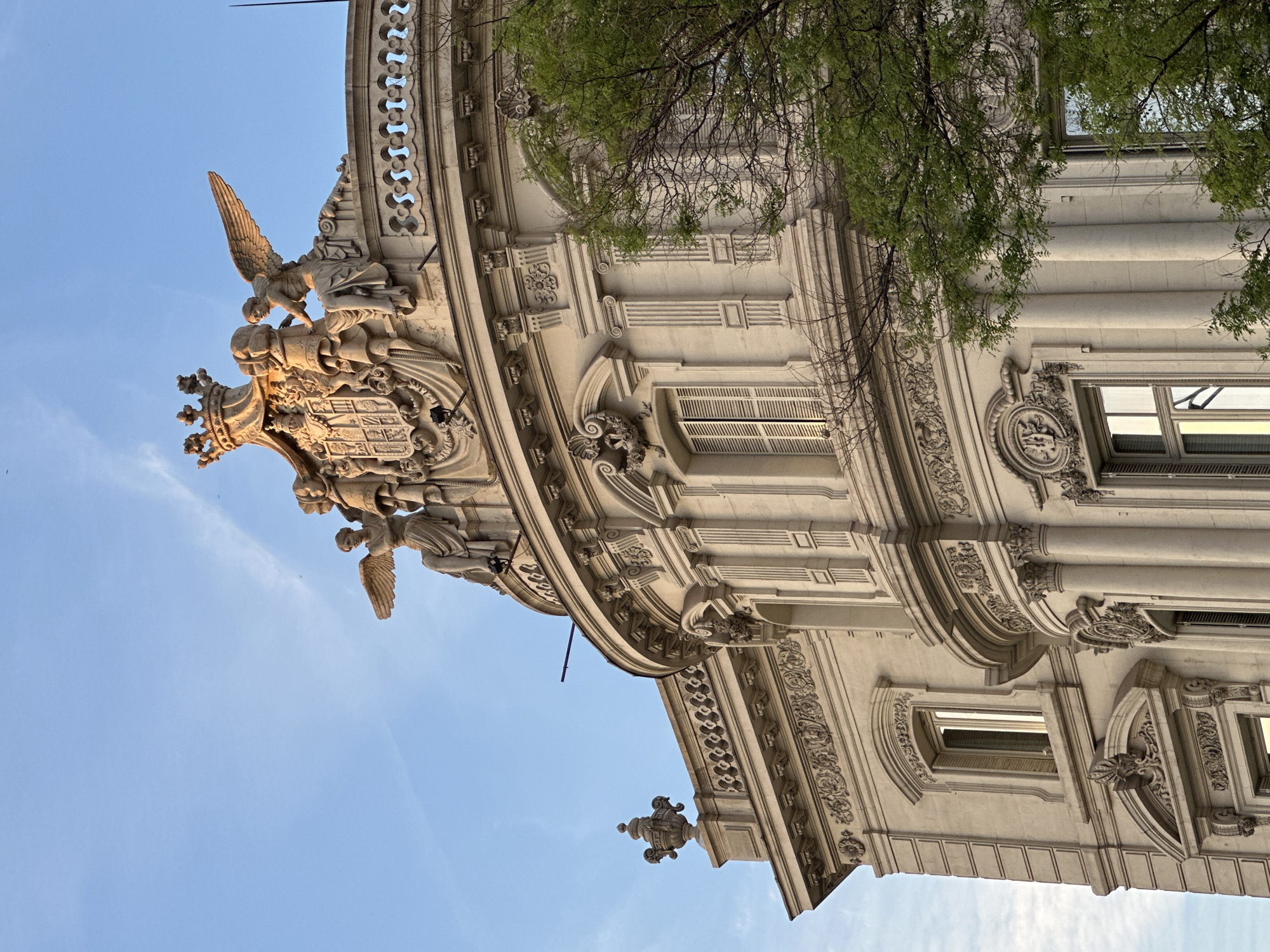 Tourist captures Madrid landmarks during evening city walk