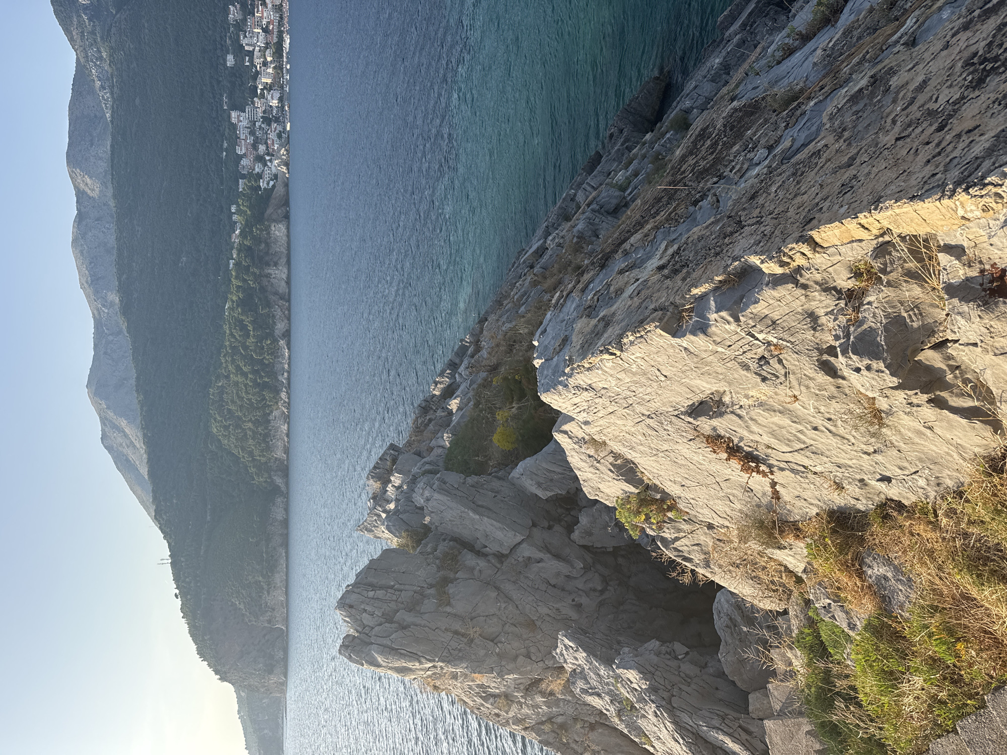 Weathered coastal stairs meet the Adriatic at Petrovac, Montenegro