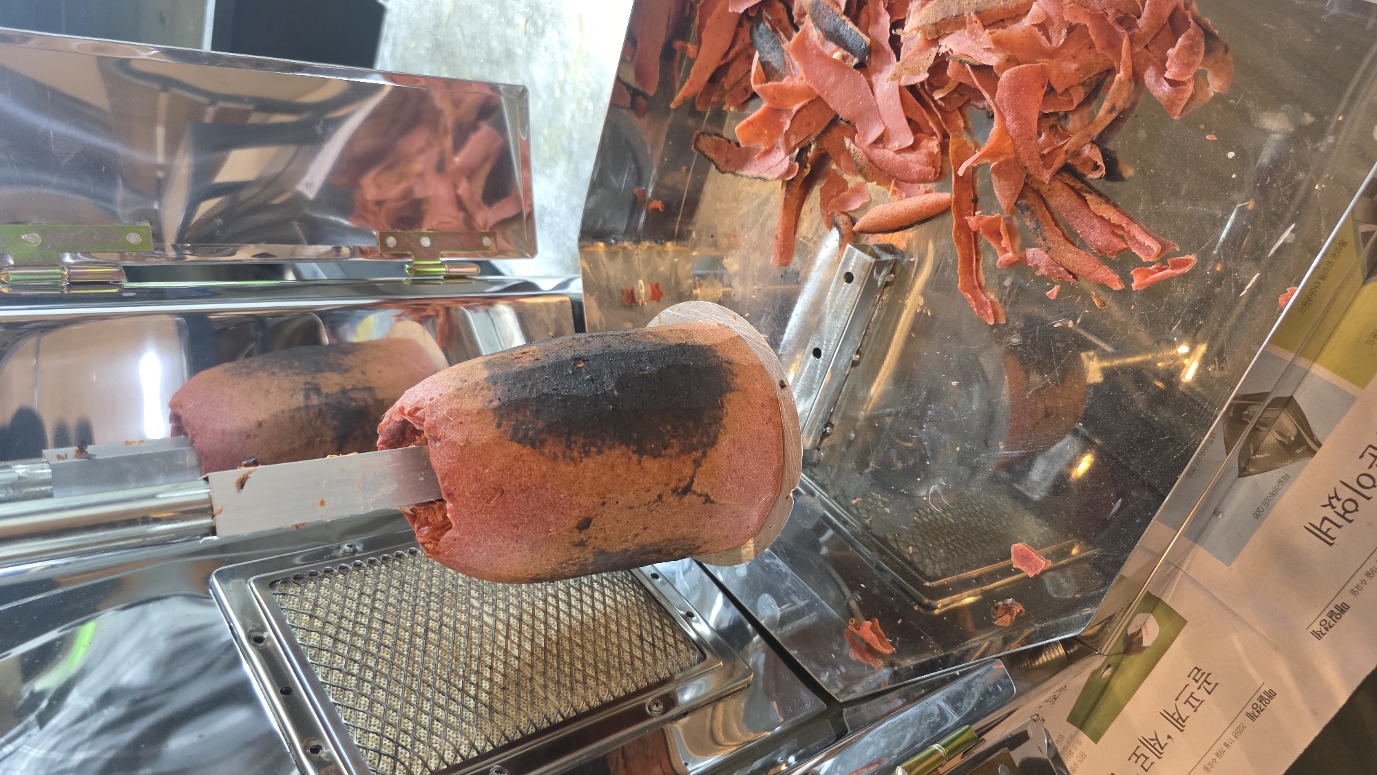 Street food vendor serves rolled wraps in Palohigeuh