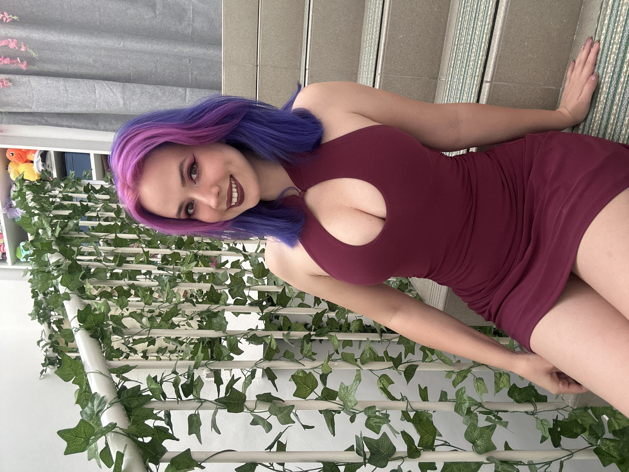 Woman poses for photos on ivy-covered staircase in Zagreb