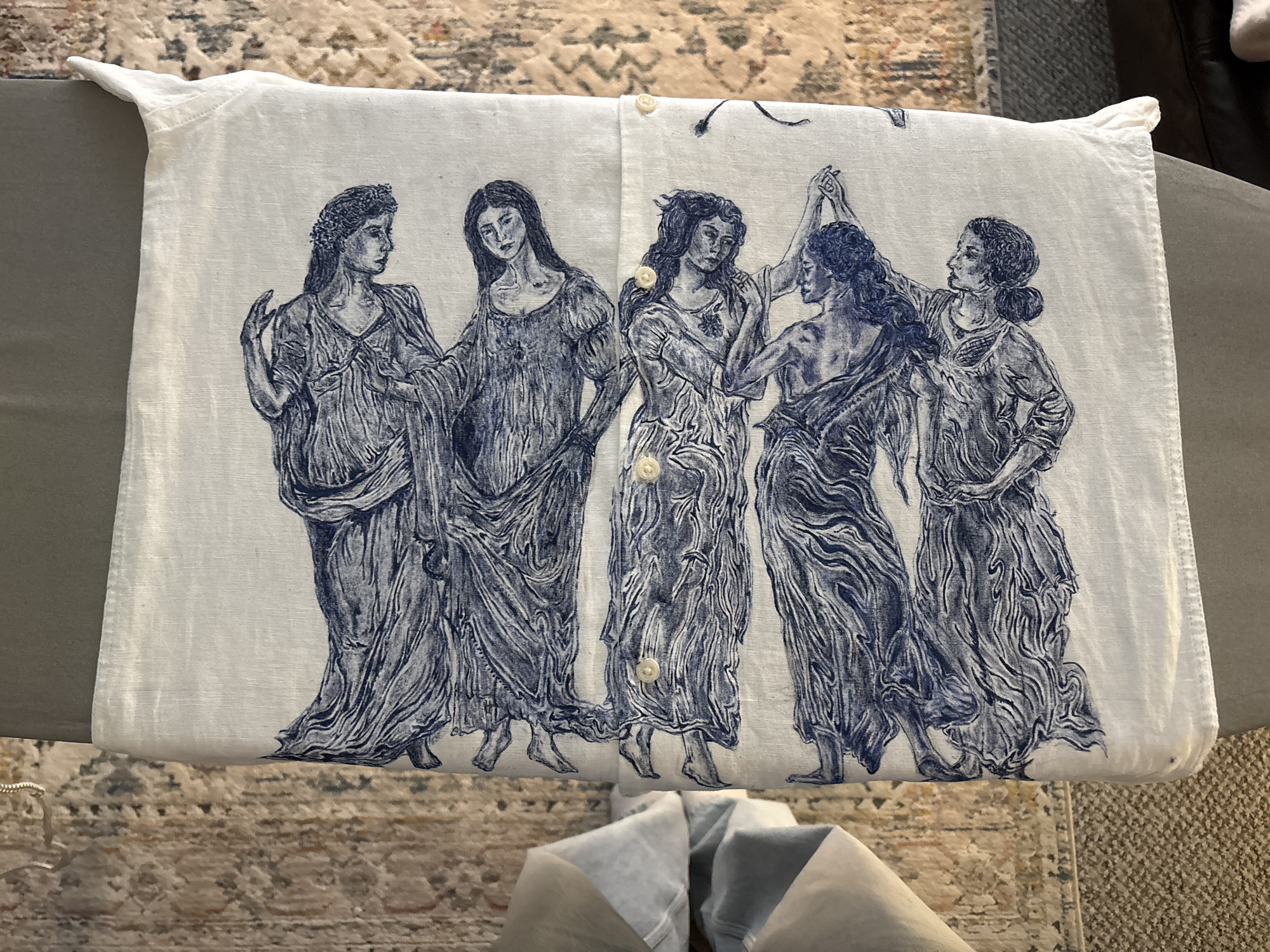Classical-print linen shirt documented on ironing surface in Manchester