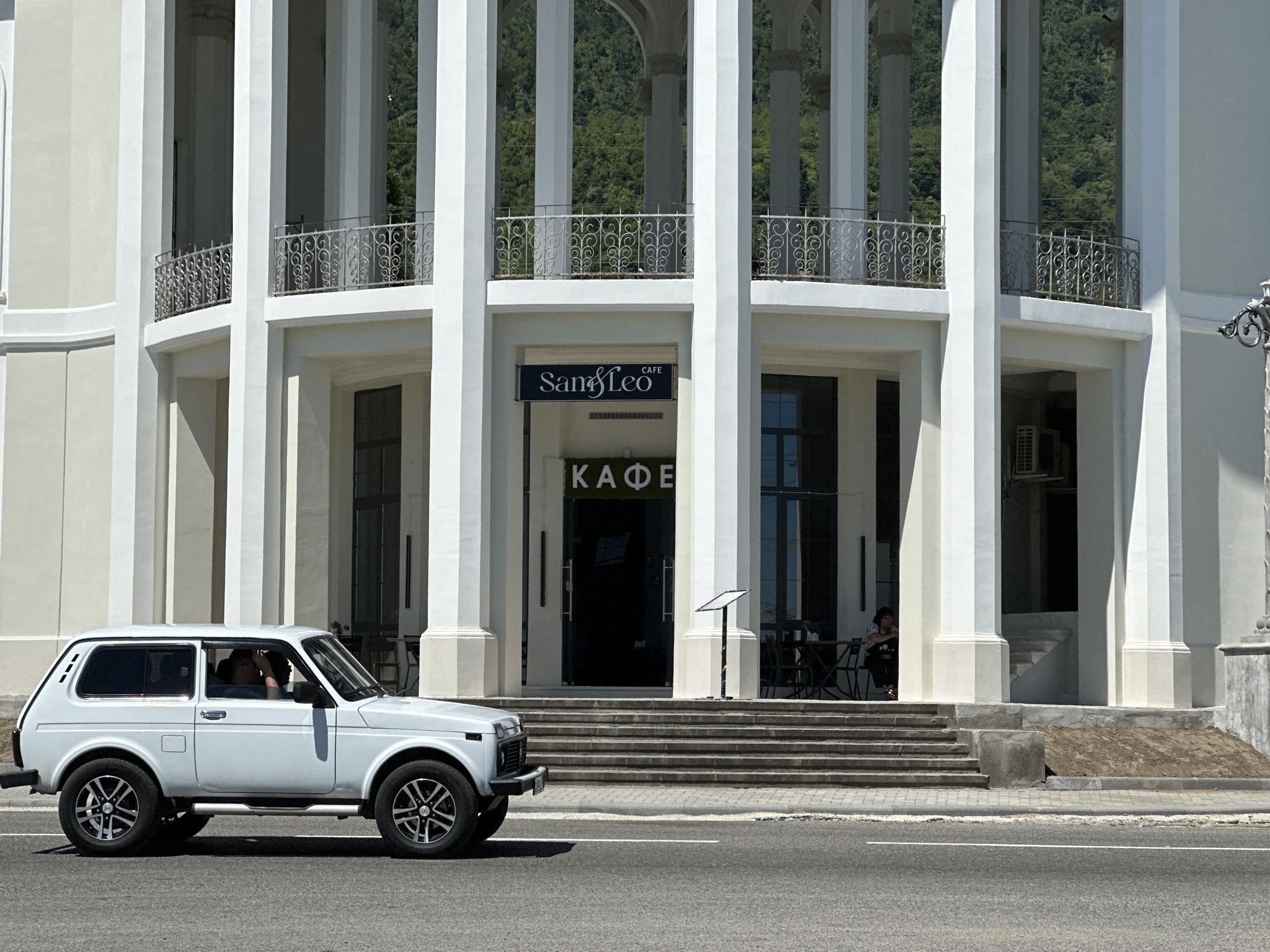 New Athos seafront: promenade life, pier jumps, and coastal architecture