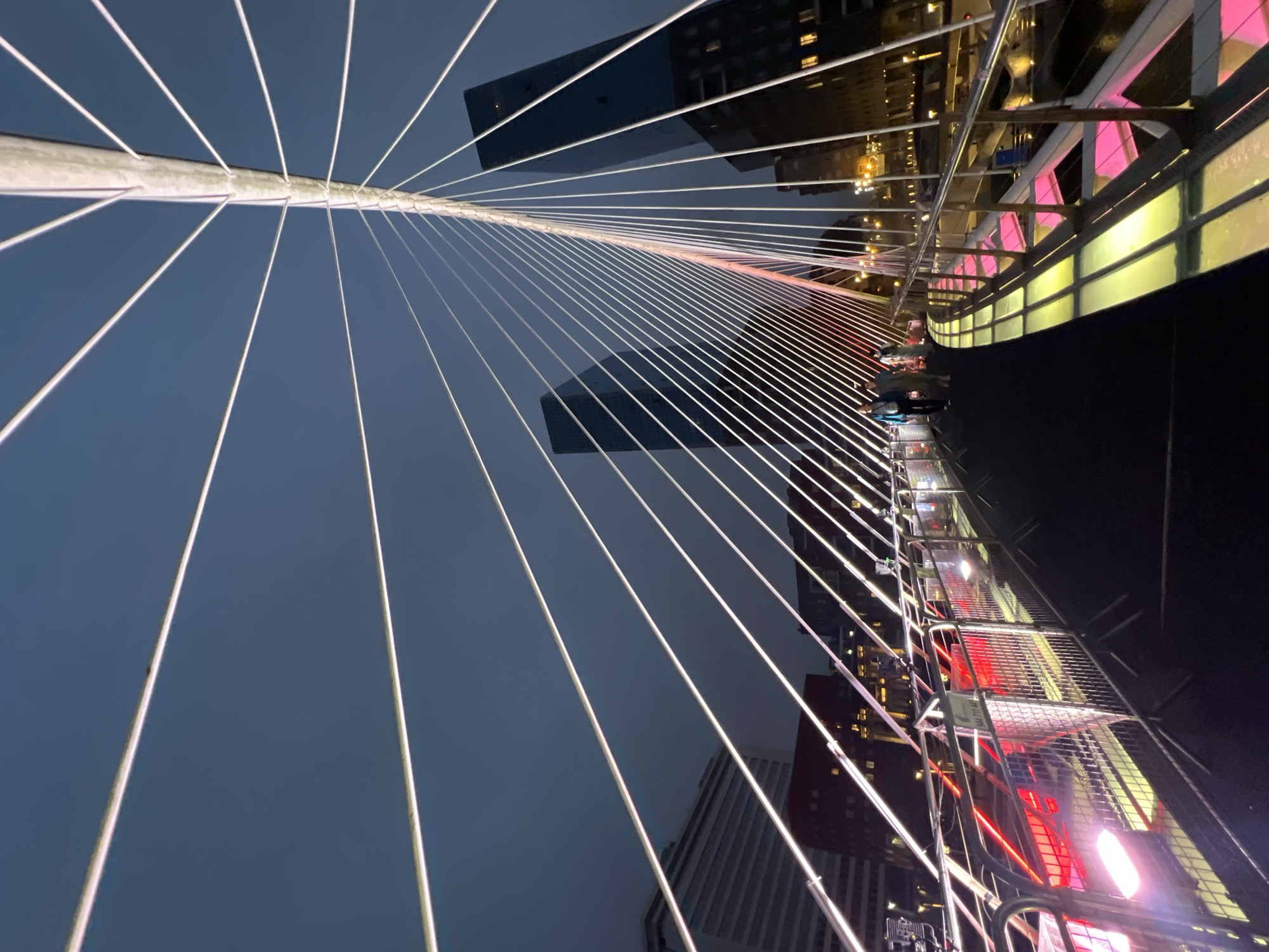 Bilbao's Zubizuri Bridge illuminated at dusk, multiple angles