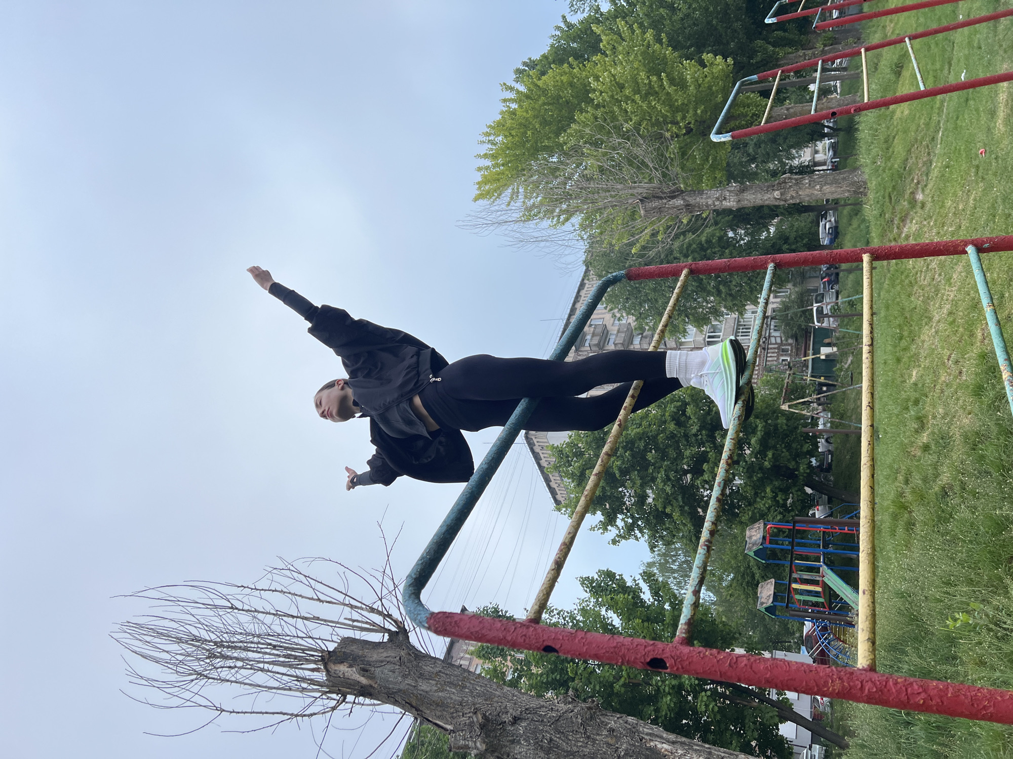 Early morning workout session at Ternopil park playground equipment