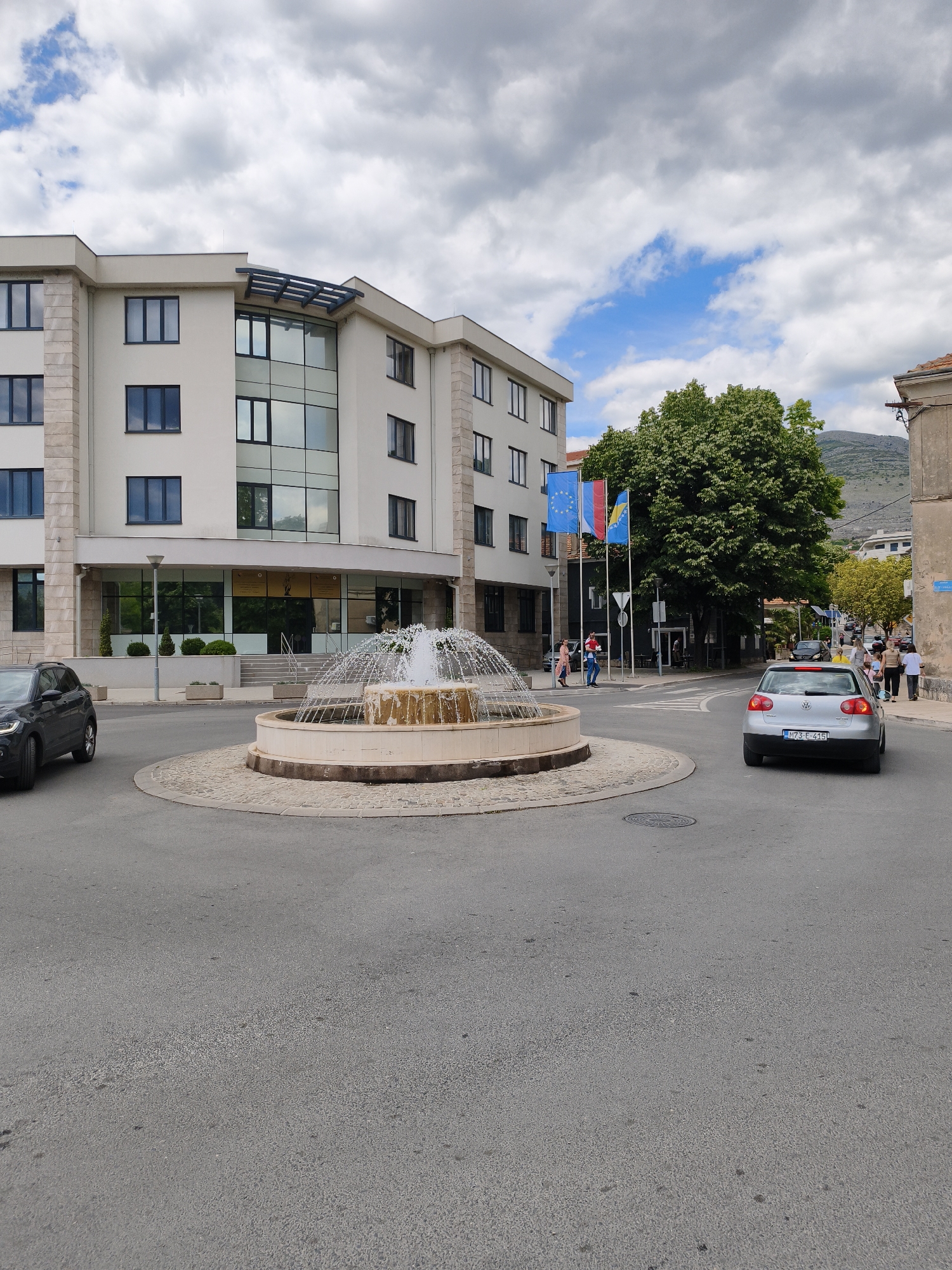 Trebinje street scenes captured including roundabout fountain and park