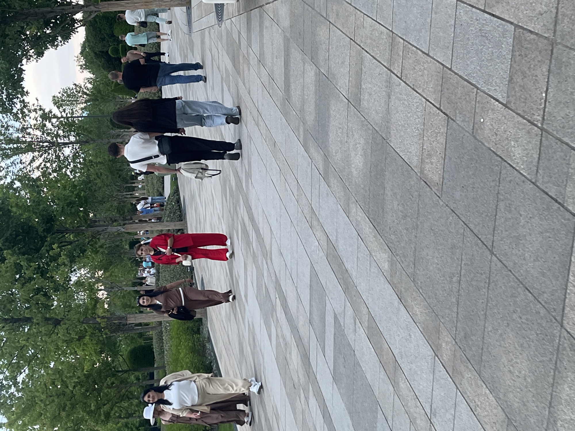 Afternoon park gathering documented around globe statue in Krasnodar