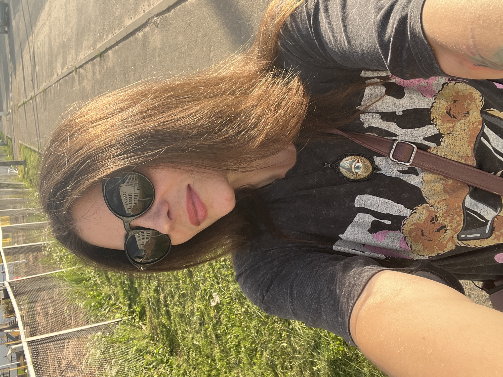Afternoon selfie session along a sunny Krasnoe-na-Volge walkway