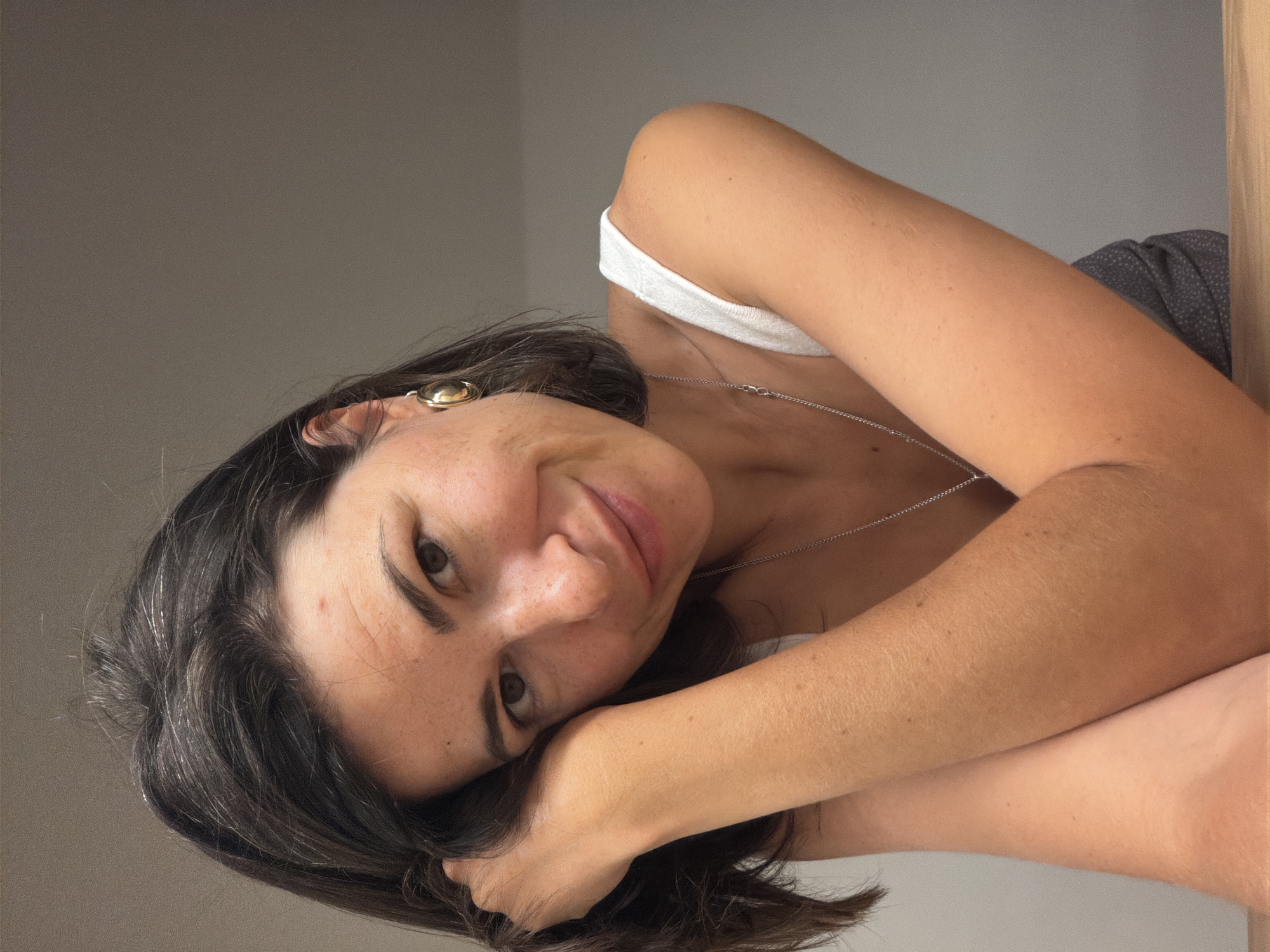 Woman poses for indoor photo session in Budva