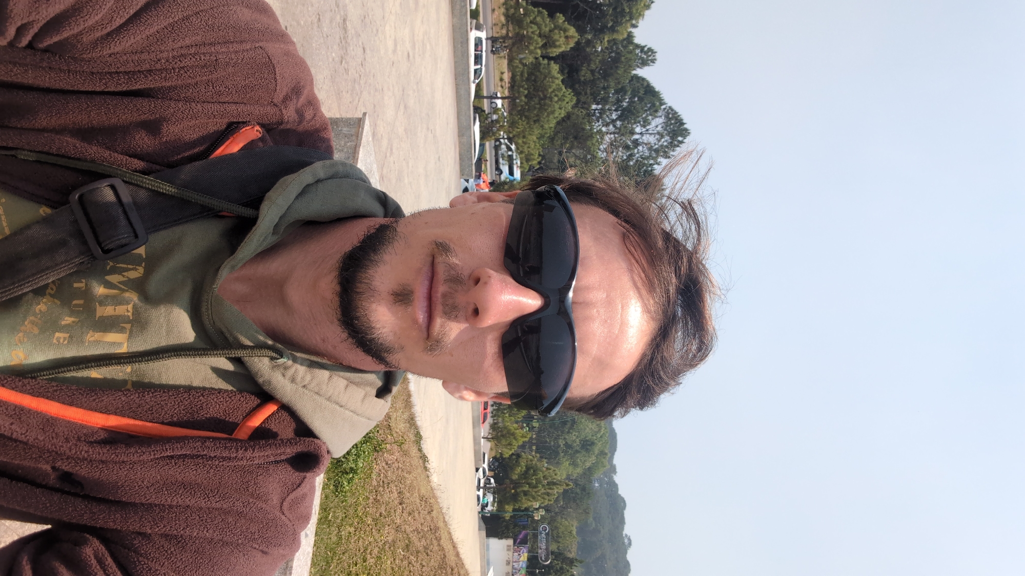 Man photographed at landscaped lakeside plaza in Da Lat