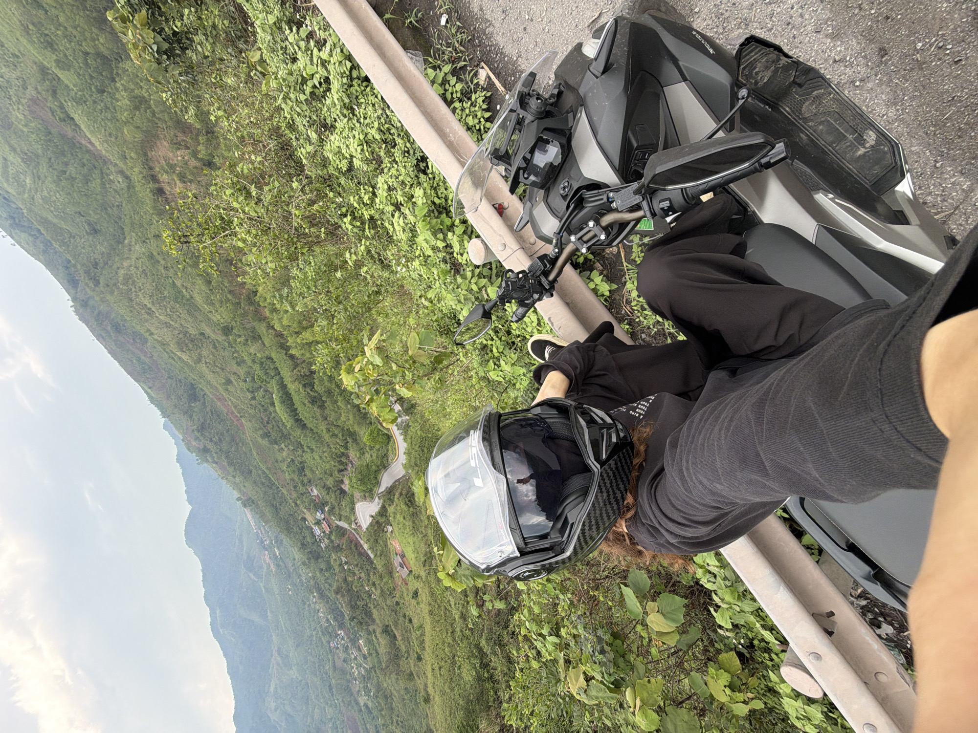 Motorcyclist pauses roadside in La Lay Commune, Vietnam