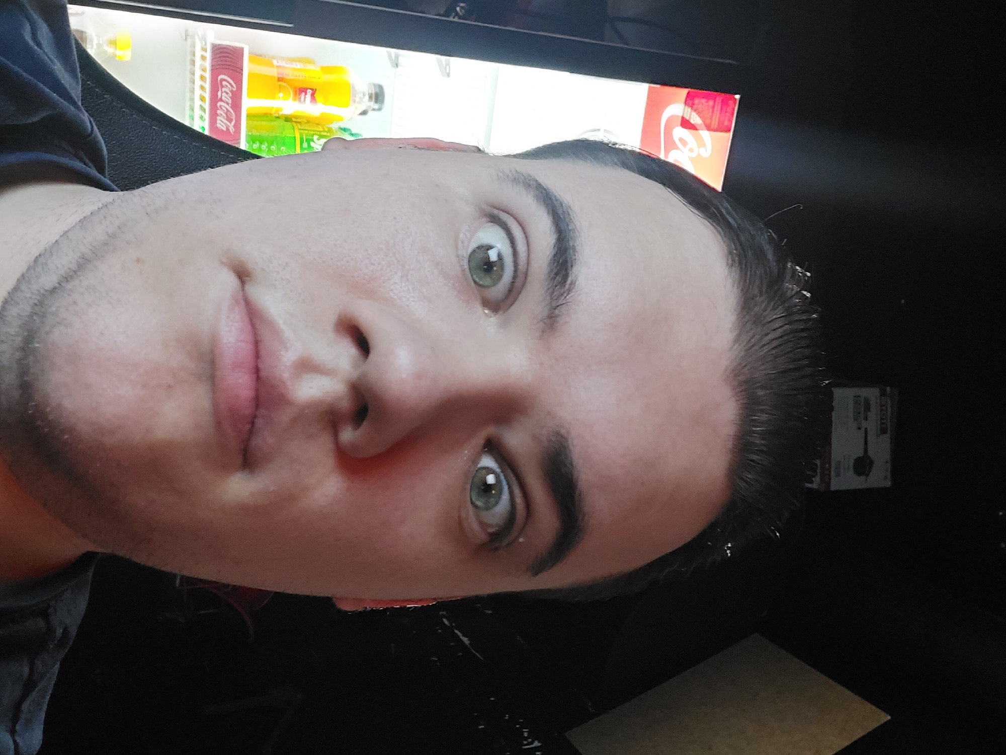 Young man documented at gaming cafe, beverage area in Tashkent