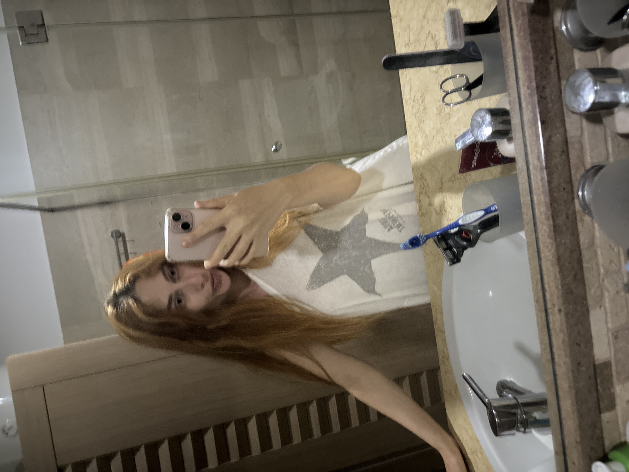 Woman Documents Evening Through Bathroom Mirror Selfies in Budva
