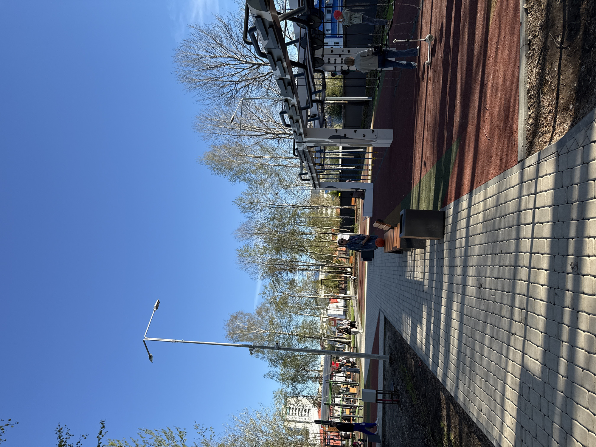 Children play in Tobolsk park during spring afternoon
