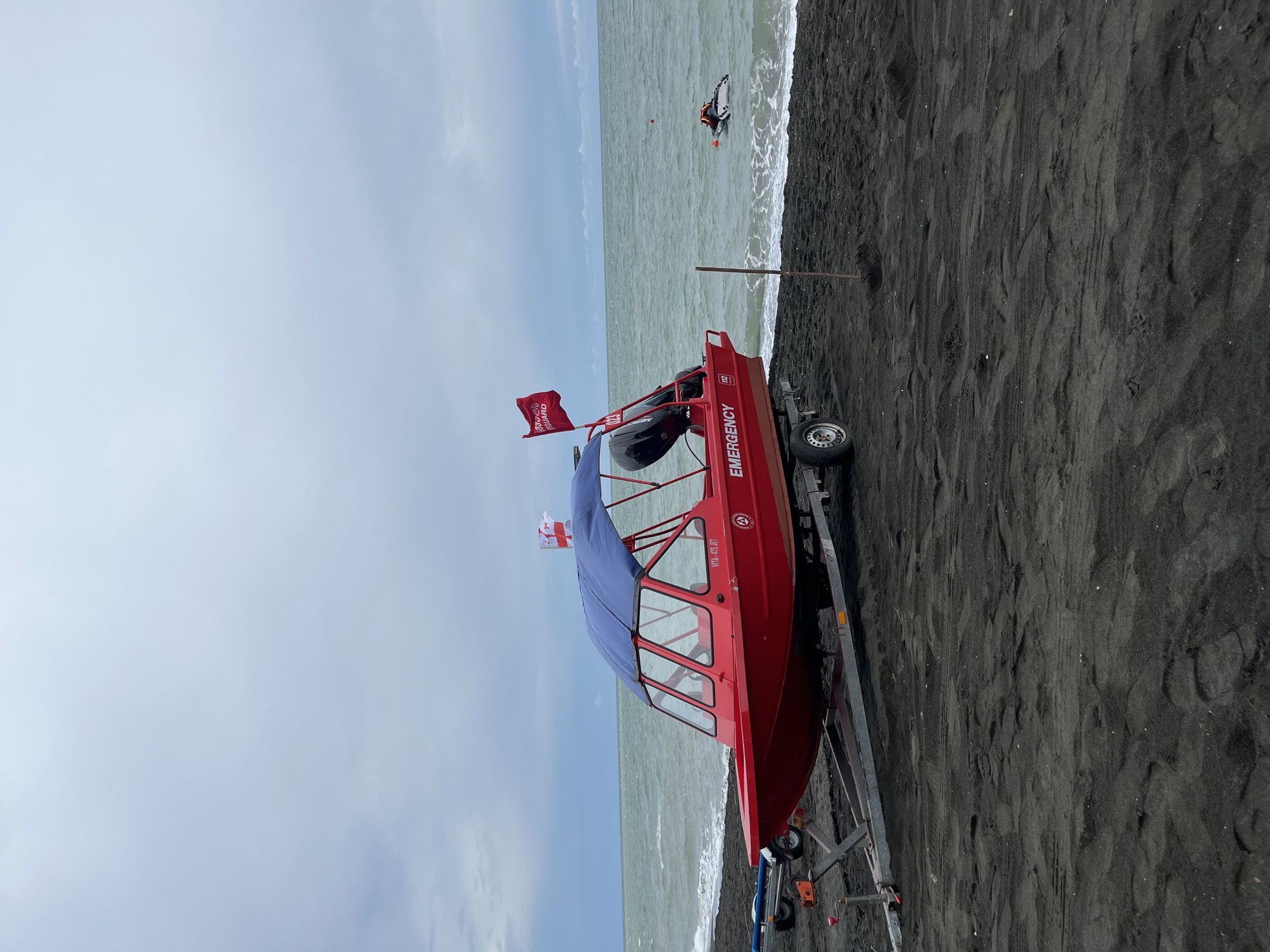 Busy morning on Ureki's black sand beach