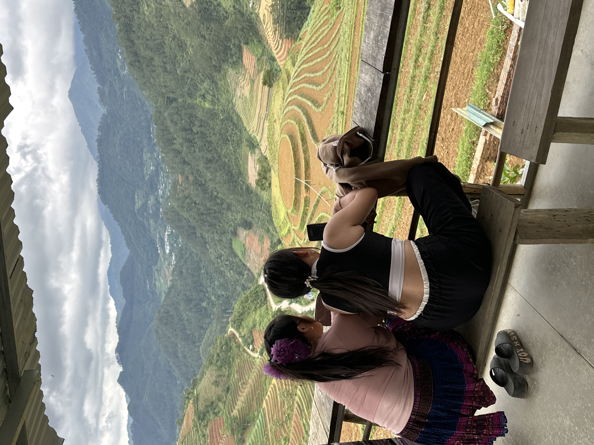 Two women observe terraced fields in Pung Luong Vietnam