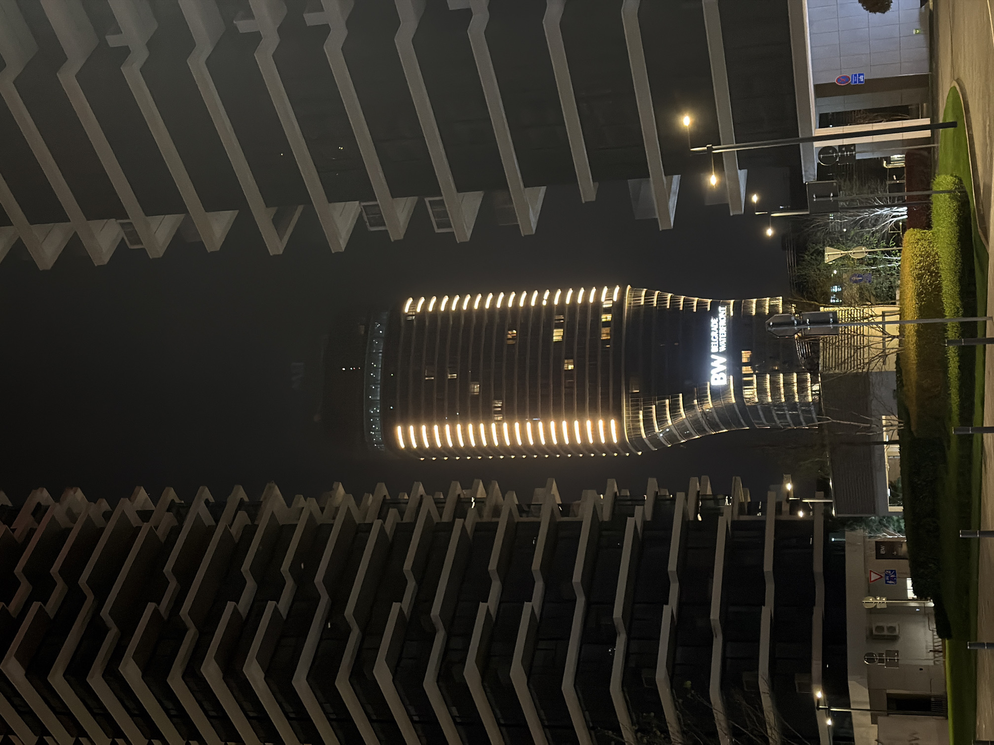 Belgrade Waterfront hotel illuminated in nighttime scene