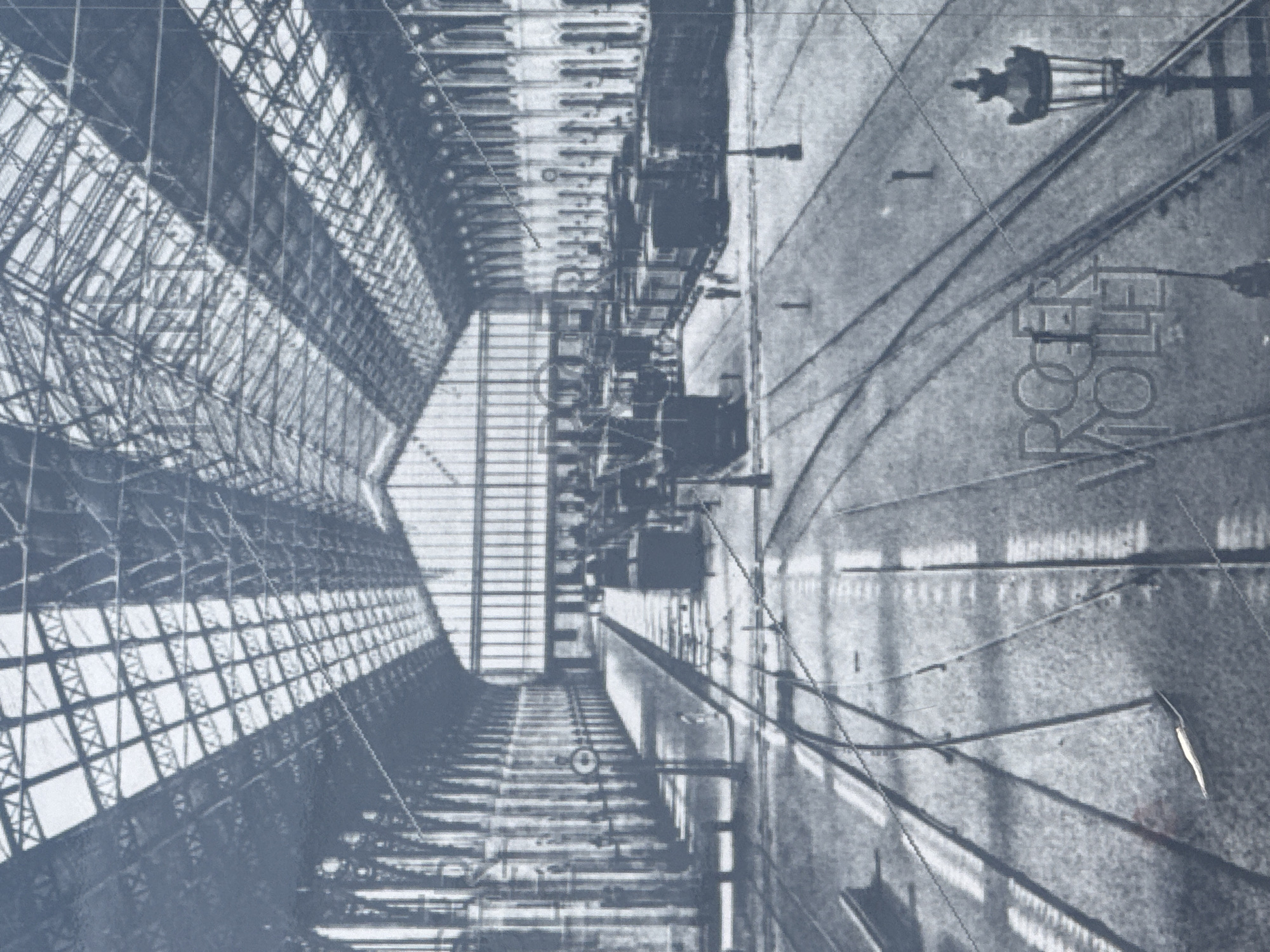 Inside a grand Paris station, tracks and ornate halls