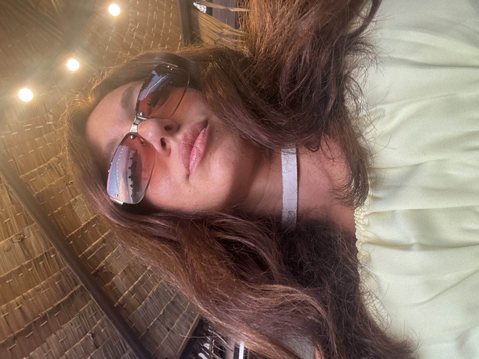 Woman takes selfie in Baan Plai Laem, Thailand