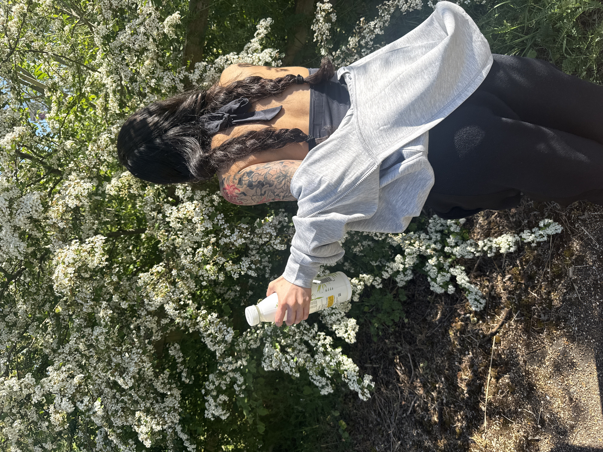 Person documents spring blooms and architecture during London afternoon walk
