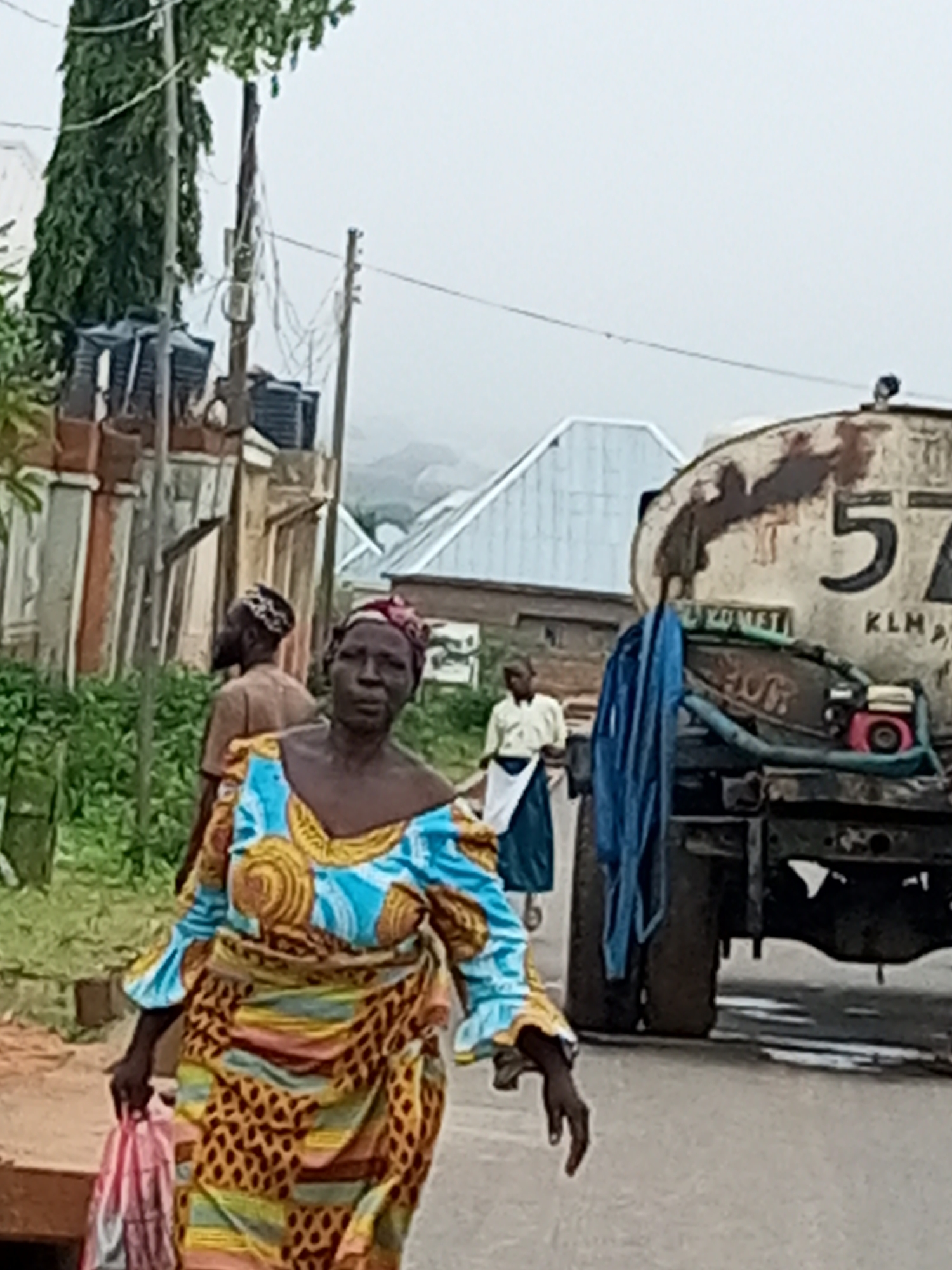 Morning foot traffic and street life in Tempure, Nigeria