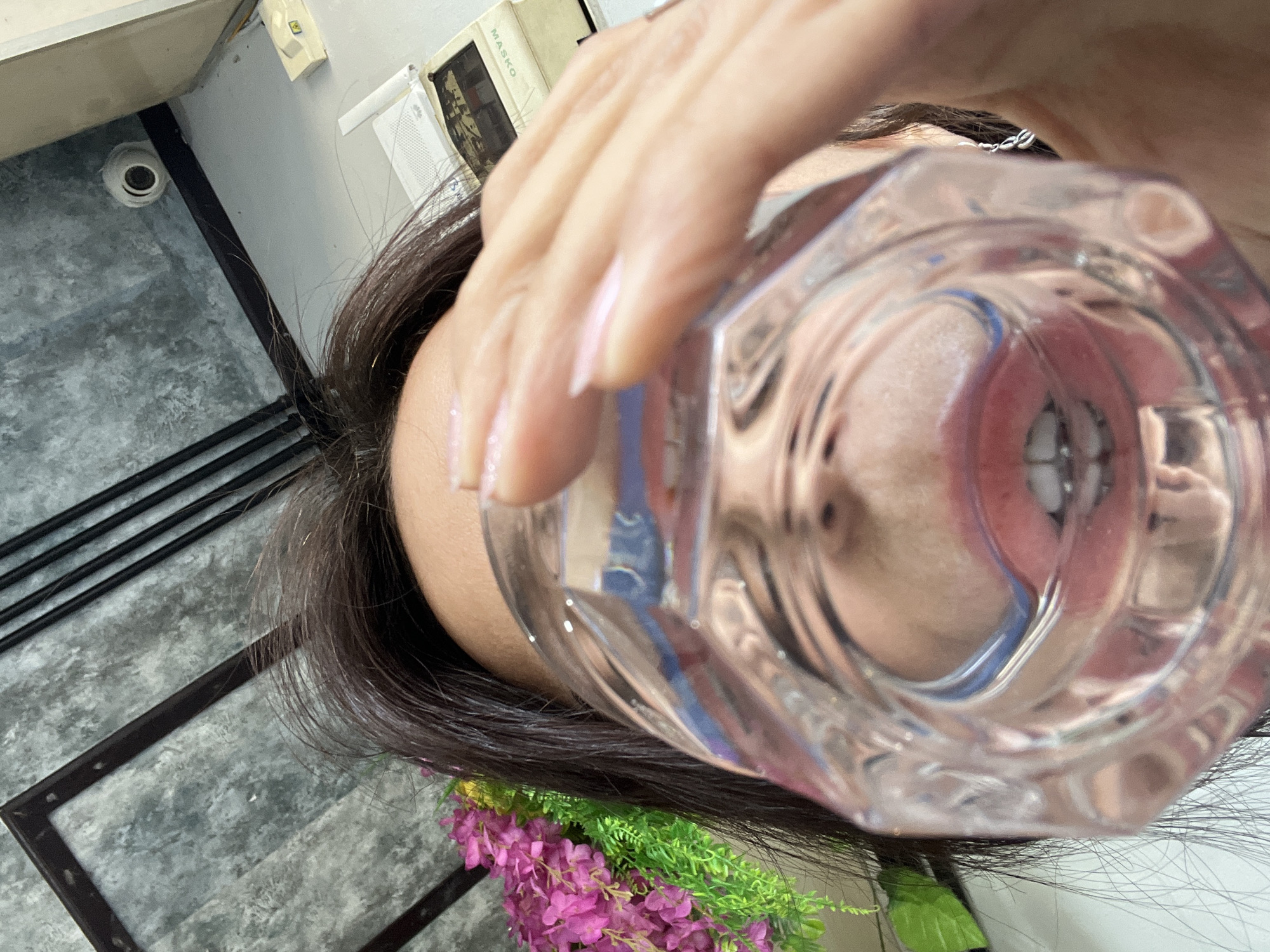 Person plays with glass distortion effects in Kuta Selatan
