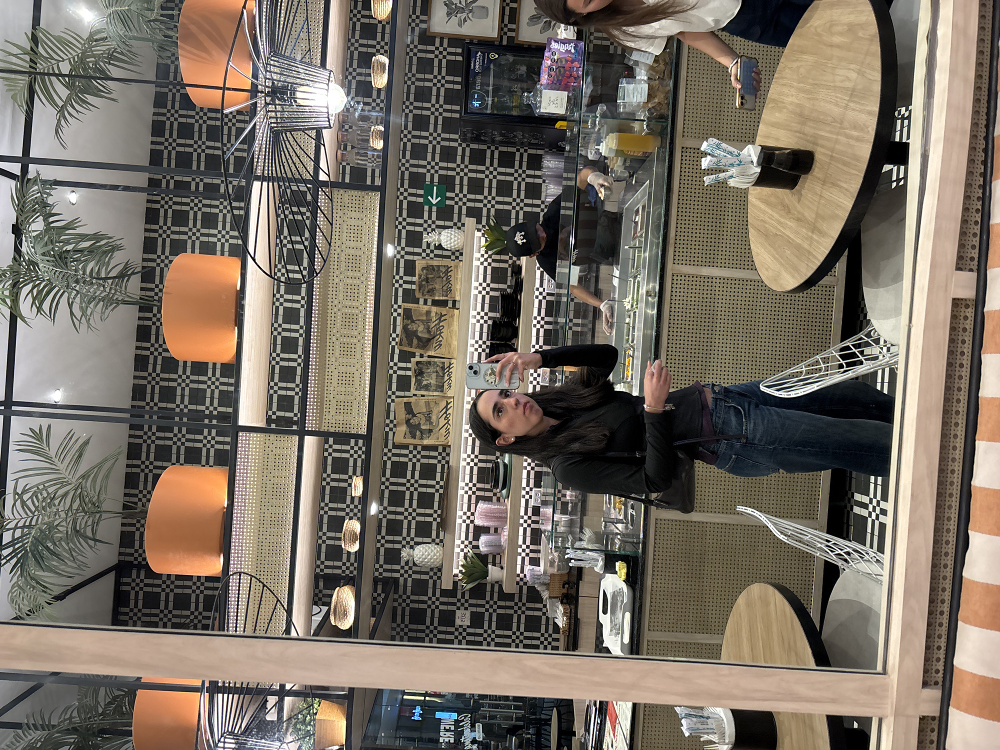 Restaurant customer photos display while worker prepares food