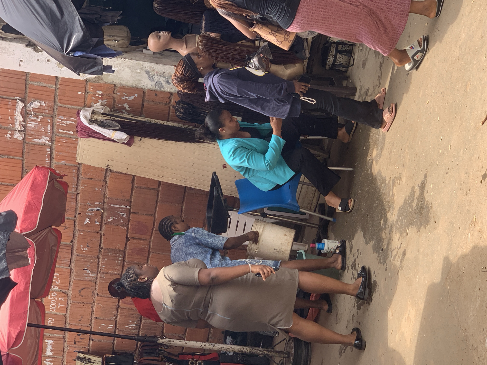 Street market hustle in Abuja, hair stalls and all
