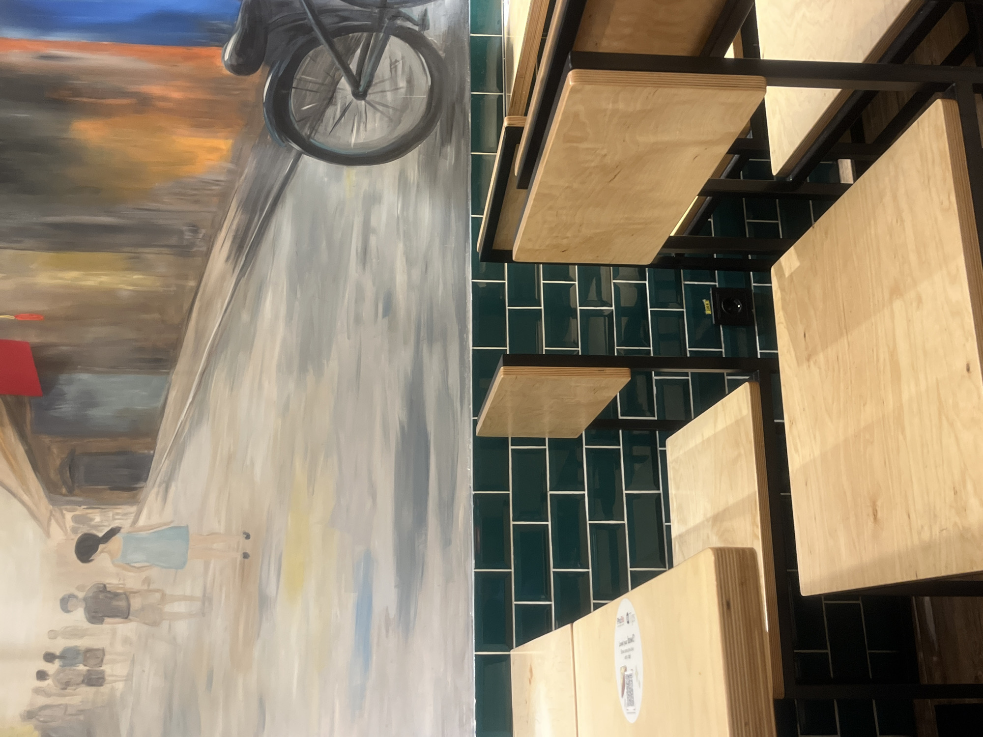 Interior scenes documented in Yerevan featuring mural and coffee packets