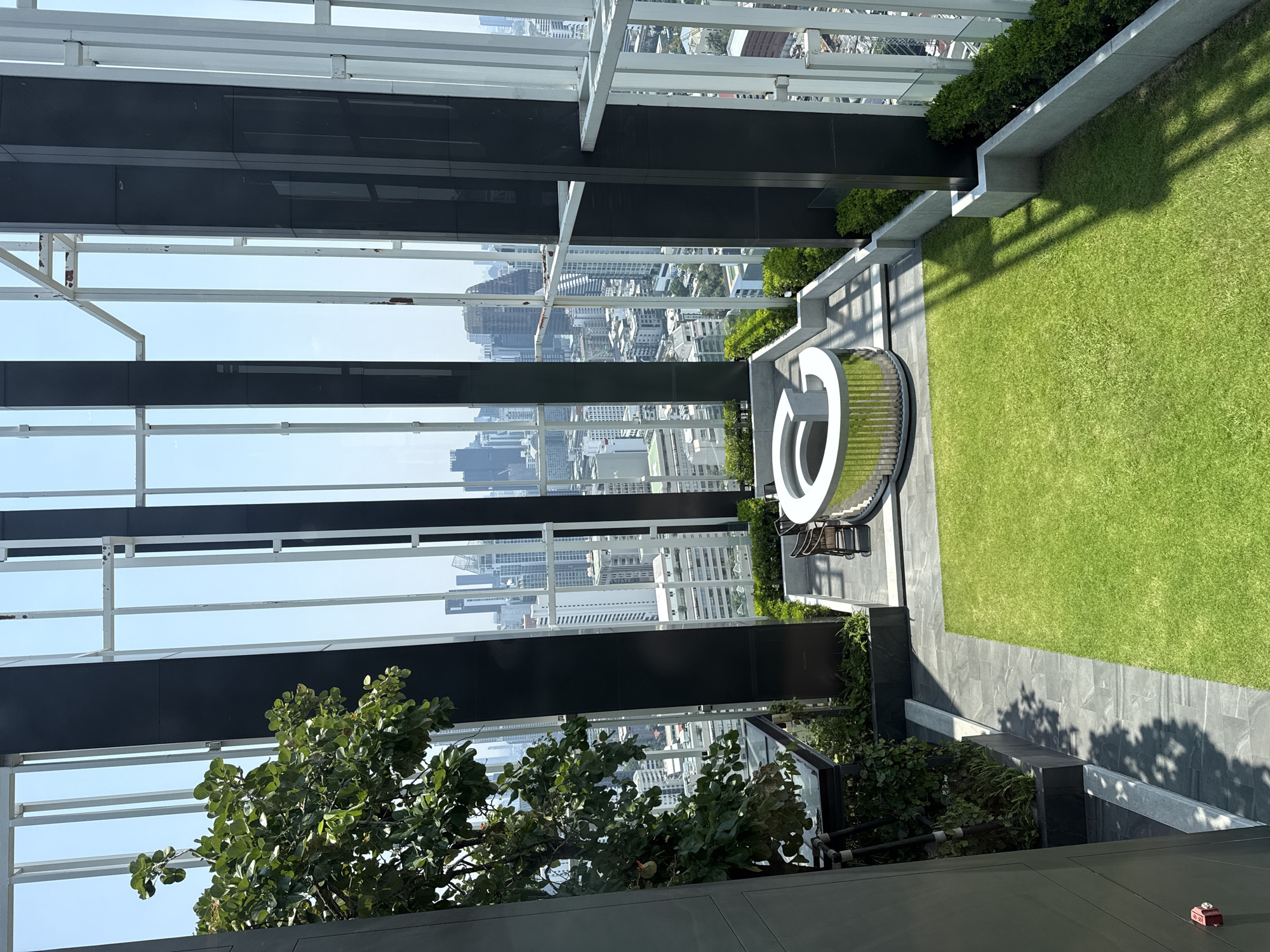 Rooftop garden view captured overlooking Bangkok cityscape