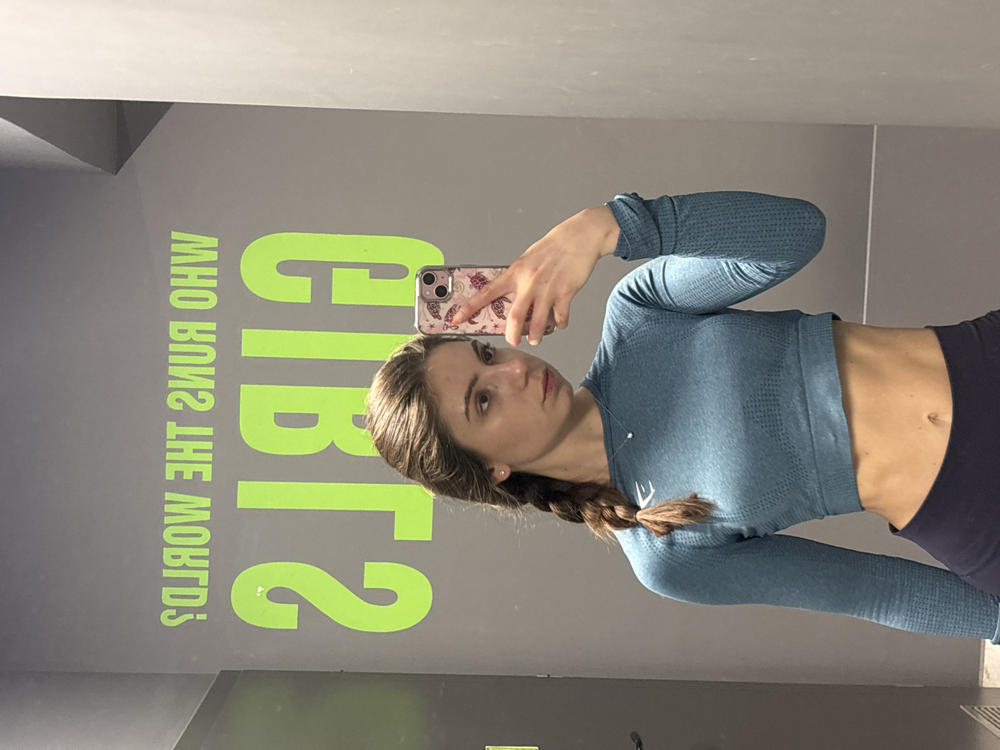 Woman takes mirror selfies at Varna gym facility
