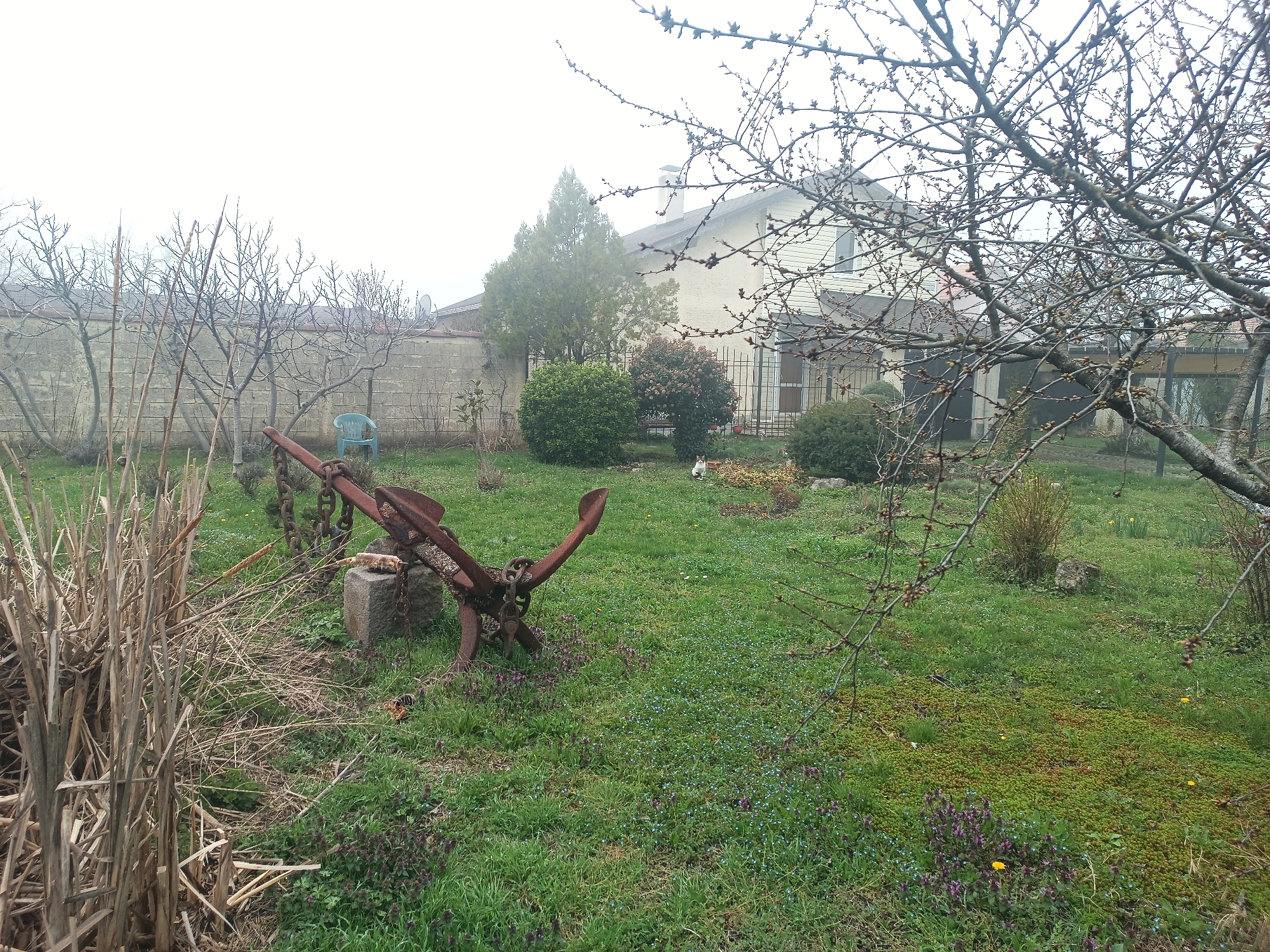 Everyday scenes documented in Kichevo: yard anchor, decorative sculptures