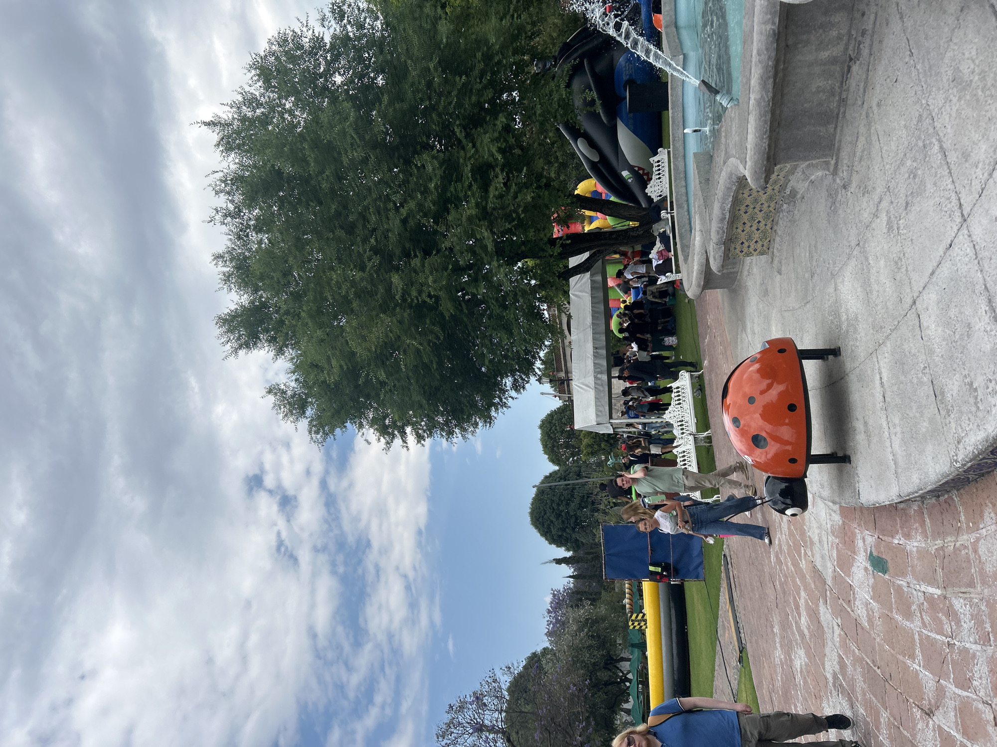 Active fountain draws crowds in park setting