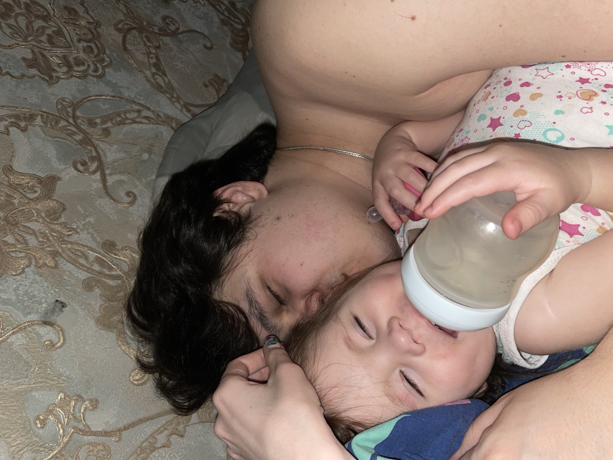 Family shares quiet bedtime moment in Izhevsk home