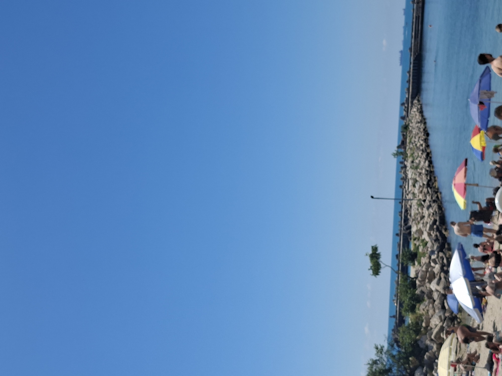 Summer day at Varna's Black Sea beach: water sports, food, sun.