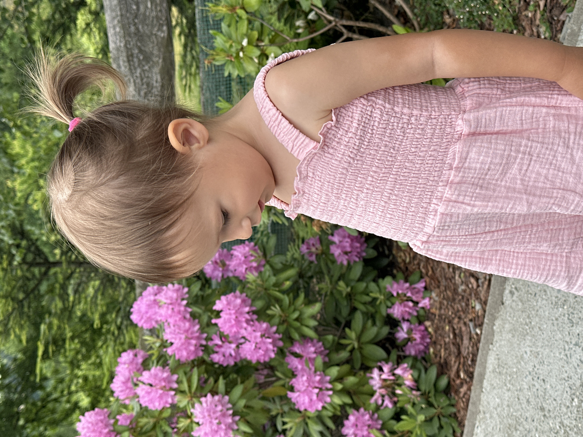 Child plays outdoors with swings, bubbles, wildlife in Wisła