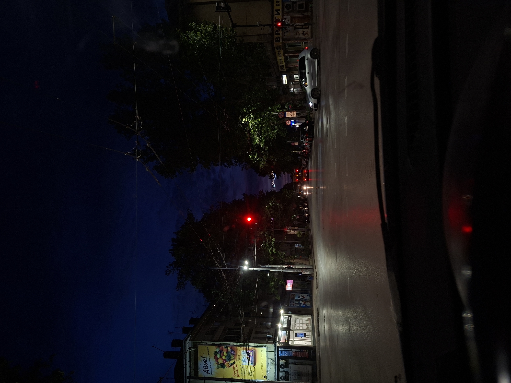Nighttime street view captured from vehicle in Pleven, Bulgaria