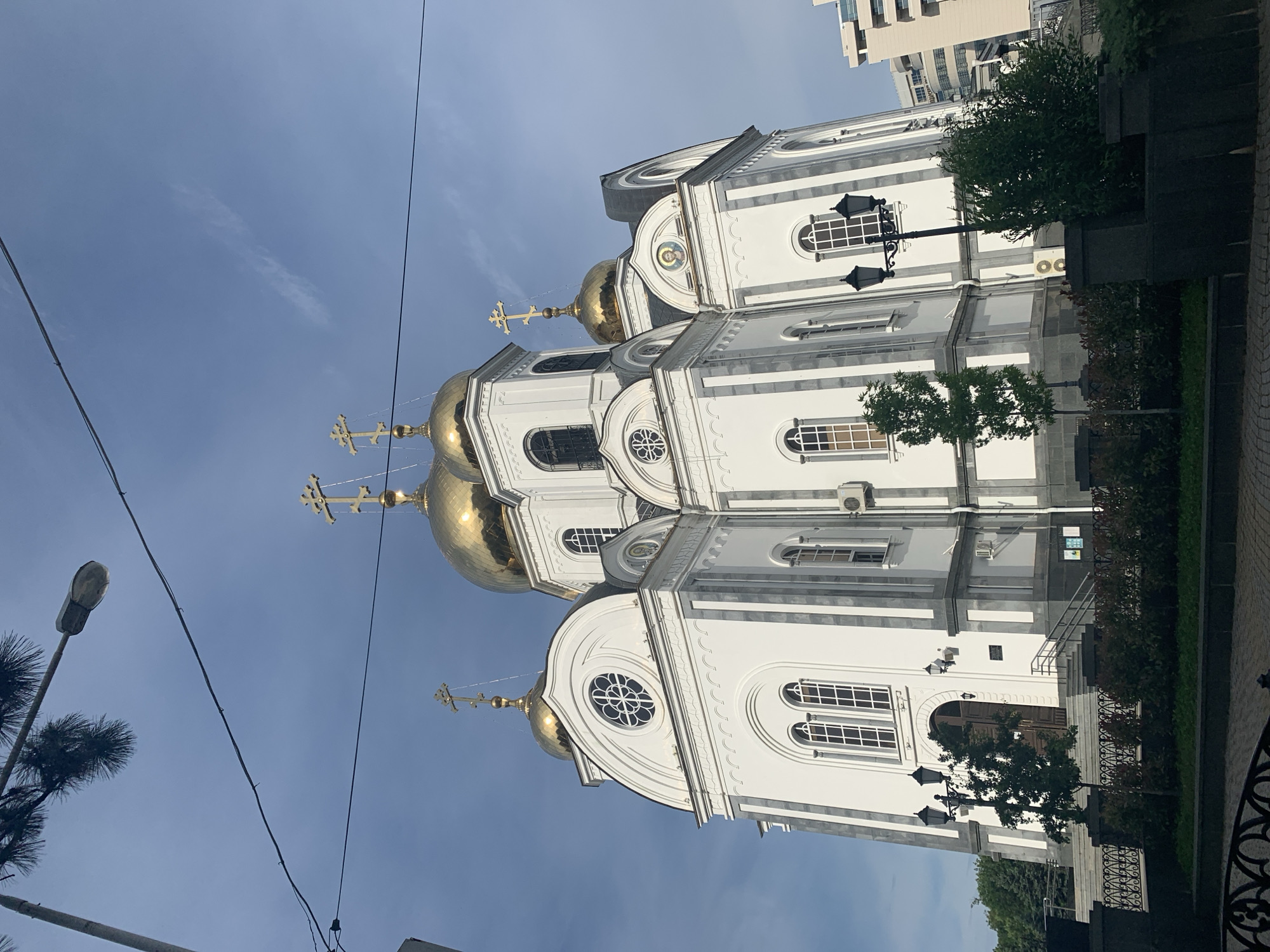Orthodox church complex with golden domes and bronze statues documented