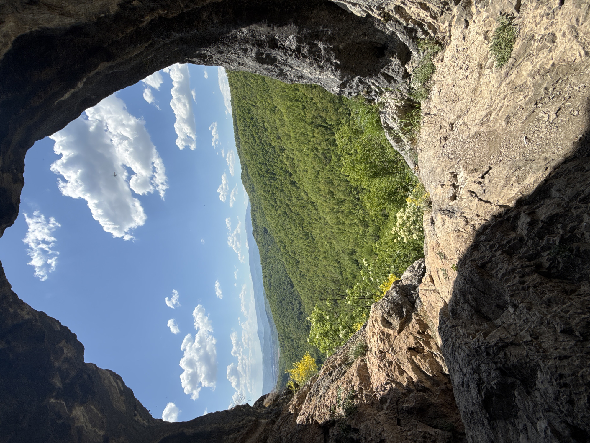 Tourist documents cave visit at Eyes Cave, Bulgaria