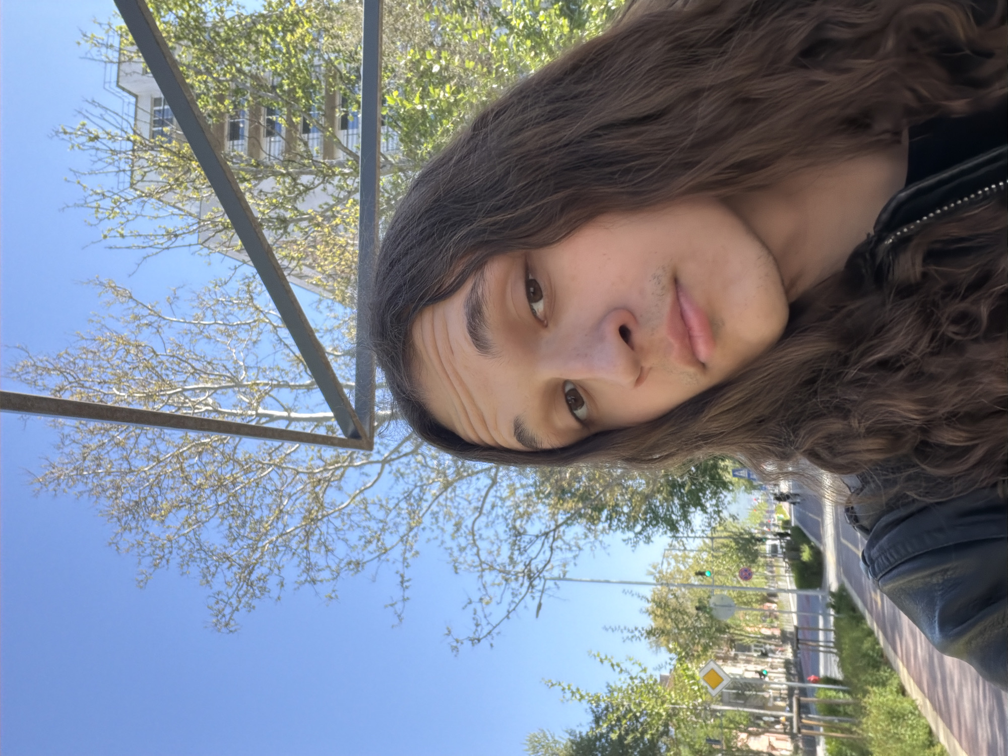Tourist takes outdoor selfies in sunny Plovdiv, Bulgaria